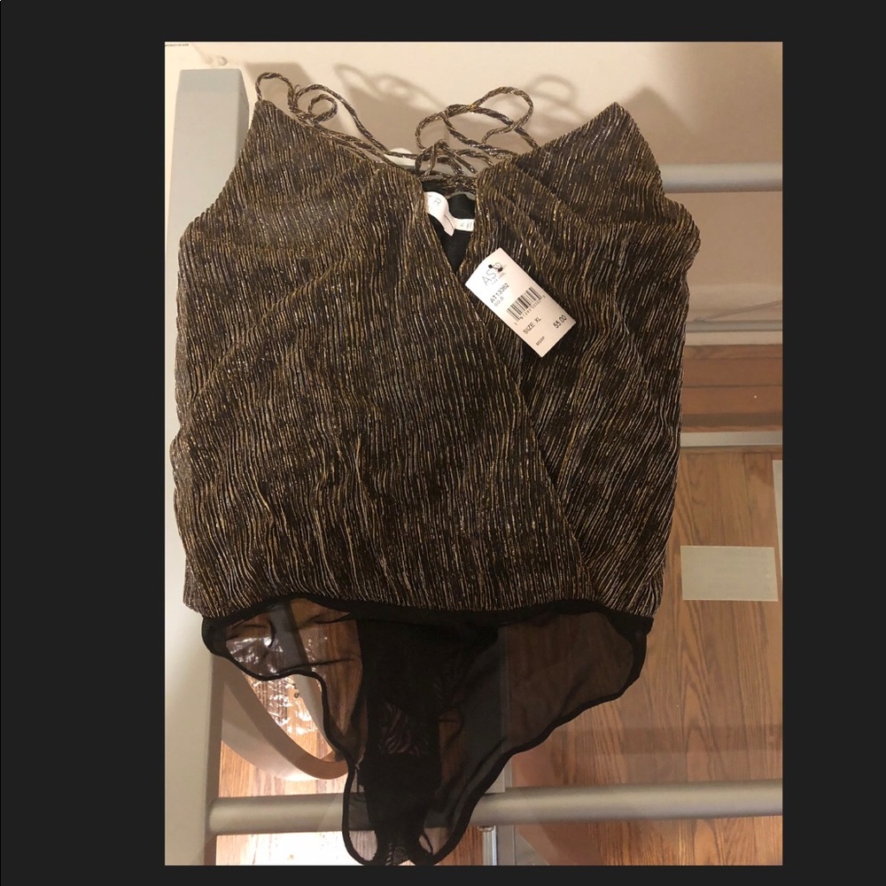 Women’s black and gold bodysuit